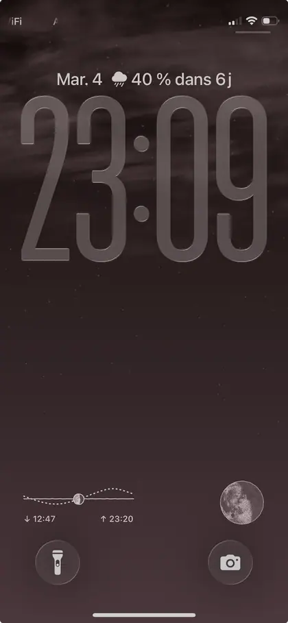 iPhone lock screen with two Plenilune complications: moonrise and moonset, and today's phase